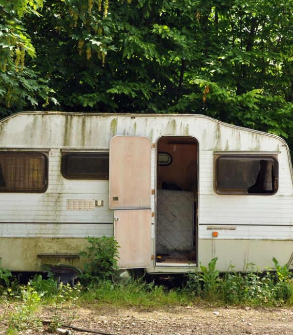 Old, decayed, and abandoned caravan